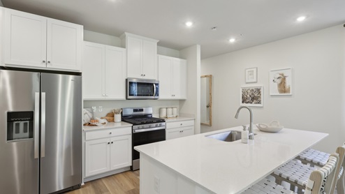 kitchen with white cabinets and countertops