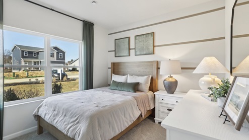 secondary bedroom with two large windows