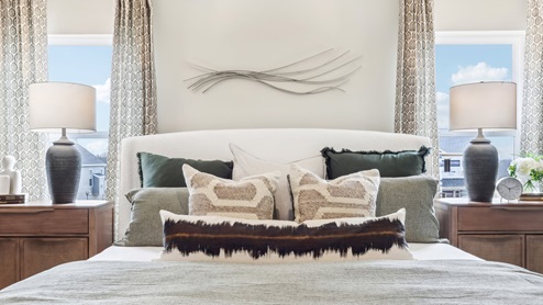 primary bedroom with two large windows