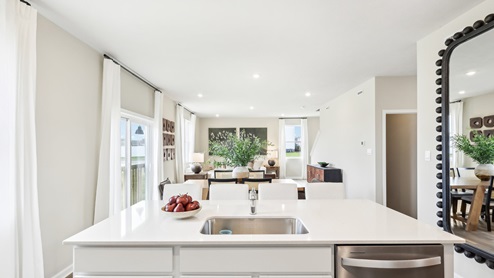 kitchen island overlooking living and dining area