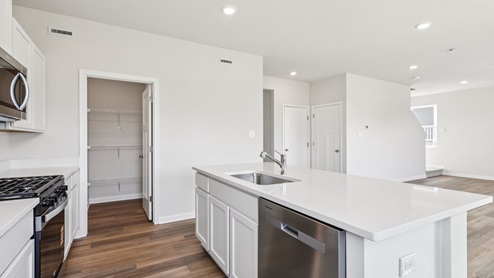 Kitchen with corner pantry