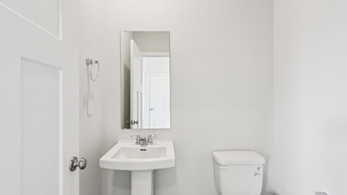 Half bath with white countertops
