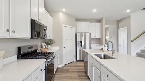 kitchen with white cabinets and countertops