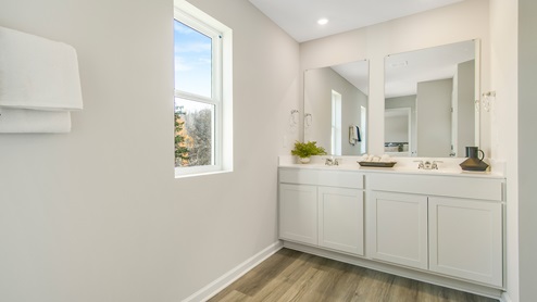 primary en suite batthroom with dual vanity