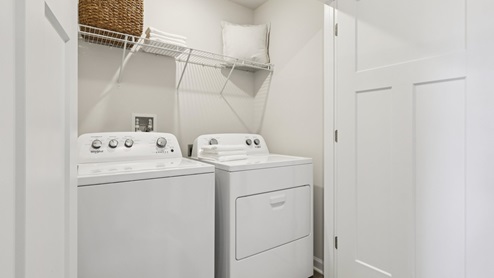 Regent laundry area with shelf