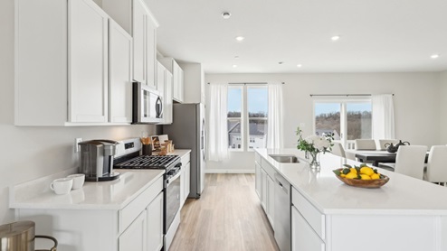 kitchenw ith white cabinets and countertops