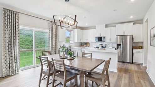 Dinette off of kitchen with sliding glass doors