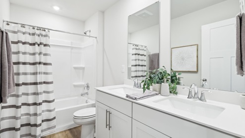 Secondary full bathroom with dual vanity