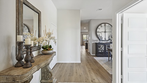 Hallway into living area with entry way furniture