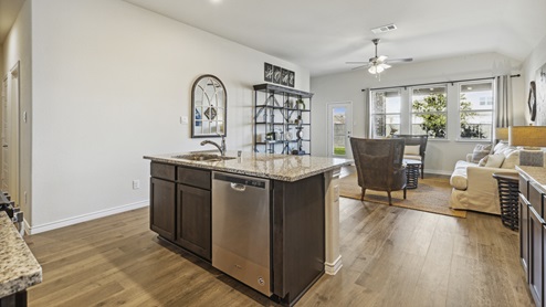 Large open concept kitchen and living room with windows