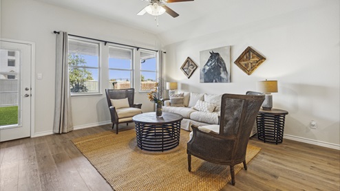 Living room with windows and simple furniture