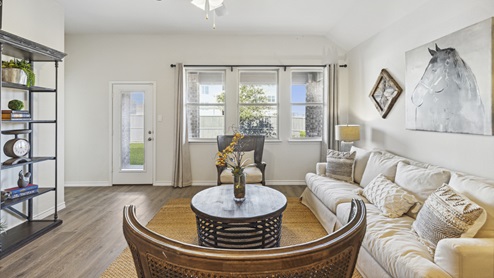 Living room with windows and simple furniture