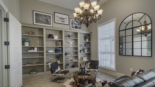 Inside Williamsburg's amenity center with lounge furniture and beautiful shelving and decor