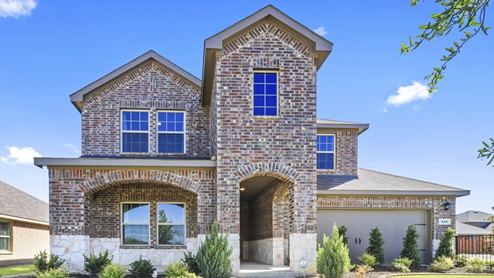 Two story elevation home with stone and brick