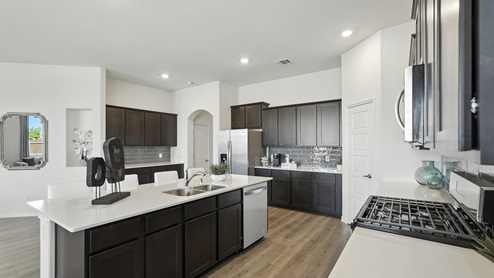 5048 Blazer Way at Fireside by the Lake in Garland, TX kitchen and living area of the model