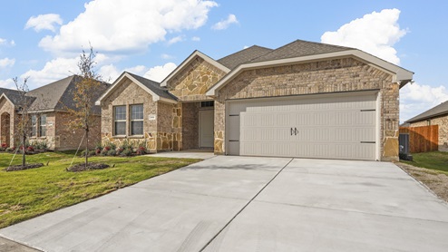 the brick exterior of a home inside the trailstone community