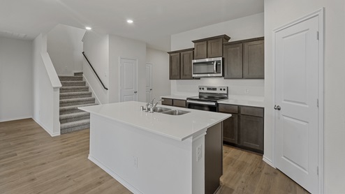 kitchen with view of staircase