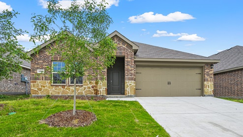 a brick home inside the stonewyck community in ennis