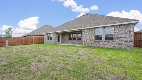 view of back exterior of one story home with covered patio
