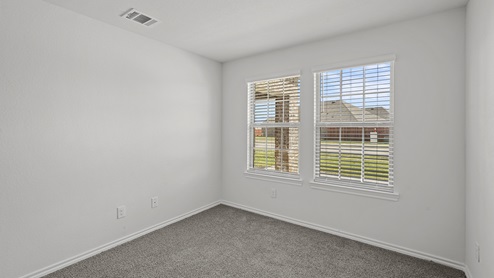 secondary bedroom with two double paned windows