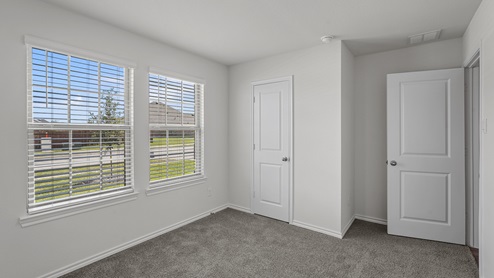 secondary bedroom with two double paned windows