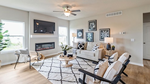 bright reagan living room with two small windows