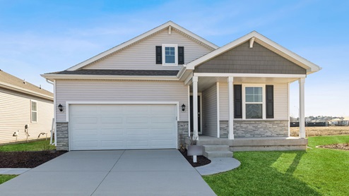 front exterior of ranch home with 2 car attached garage