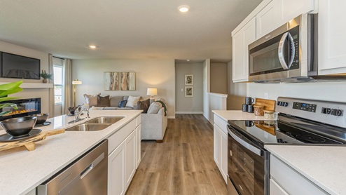 Spacious kitchen with island and stainless-steel appliances