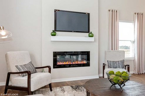 living room with electric fireplace and small window