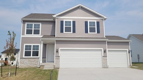 front exterior of bellhaven home with 3 car attached garage