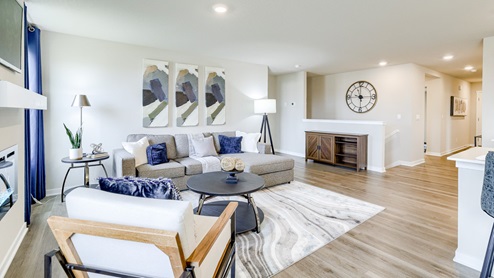 living room of the hamilton with couch and chair and a coffee table