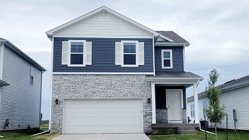 The Edmond 2 story home exterior with 2 car garage
