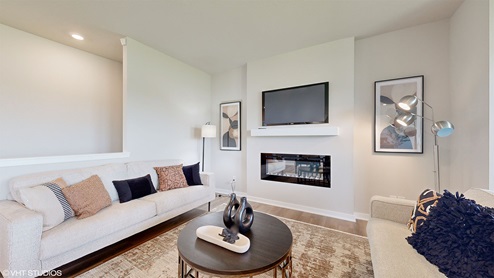 Living room with mounted tv and electric fireplace