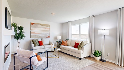 Bright living room with couch and chairs