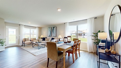 brown dining room table overlooking the living room