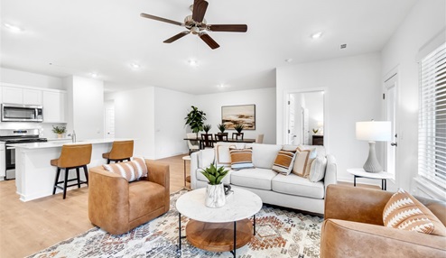 Open concept living space featuring a spacious living room area next to the dinning room.