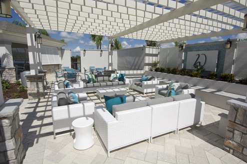 Outdoor area with couch seating and tables and seatings.