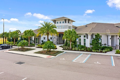 Parking to clubhouse that includes, gated access, fitness and gathering areas.
