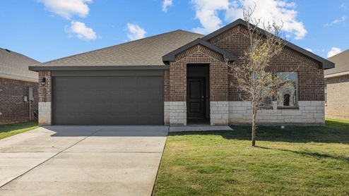 Single story home with brick, stone, covered patio with 2 car garage