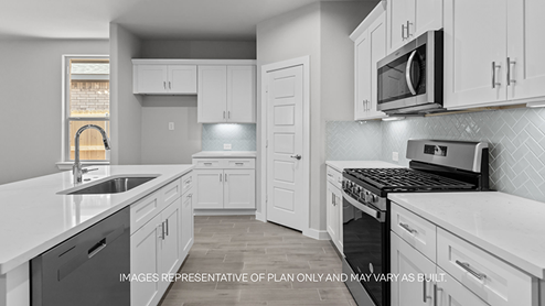 kitchen with spacious island, quartz counters and stainless-steel appliances