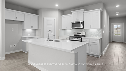 kitchen with spacious island, quartz counters and stainless-steel appliances