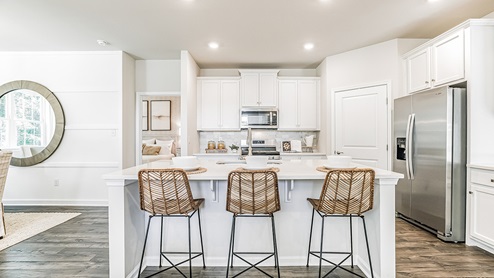 white kitchen with white island