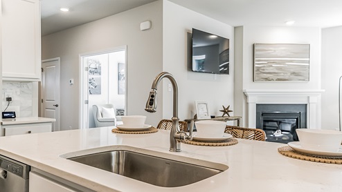 white kitchen with white island