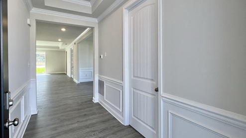 Large hallway entrance with upgraded wood trim.