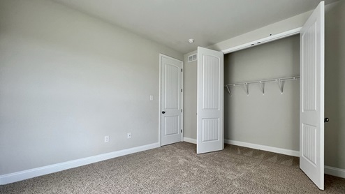 Large closet in secondary bedroom.