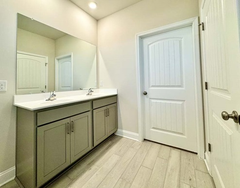 Guest bathroom with double bowl vanity.