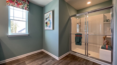 Primary bathroom with a walk-in shower.