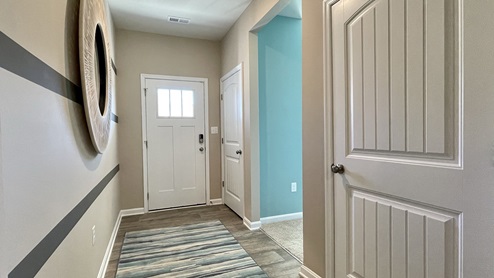 The home's foyer features two convenient coat closets and a flex room.