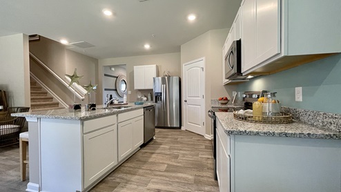 The spacious kitchen has a large island with room for seating.