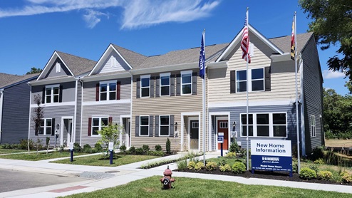 Riverwalk Terrace exterior model of Jefferson townhomes.